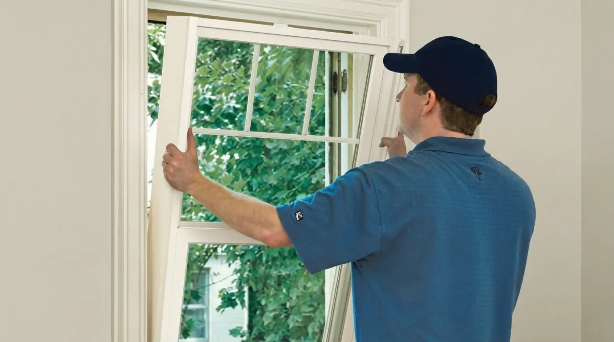 Professional contractors performing a residential window insulation and replacement service in Chula Vista, CA